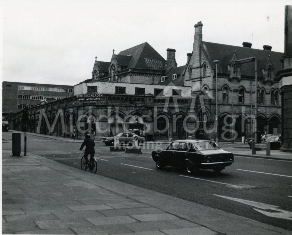 Photograph of the junction of Zetland Street, Albert Road and Marton Road showing Winterschladen's Corner at the Corner and the Railway Station